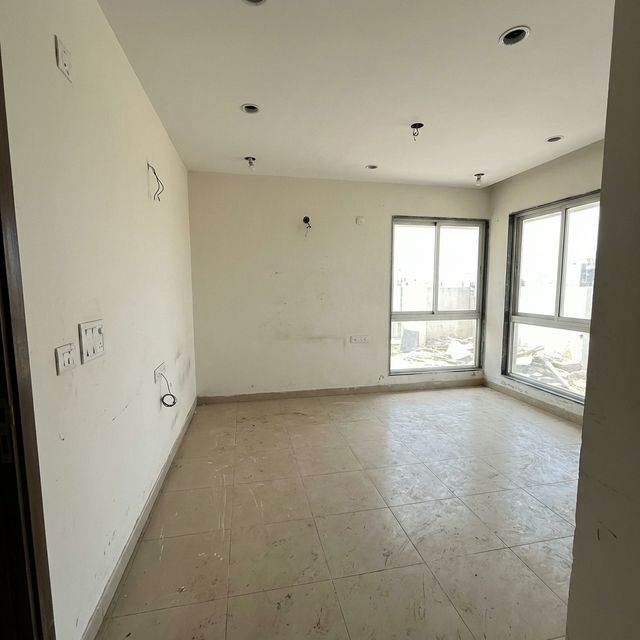 Empty room before interior design renovation - bare walls and basic flooring
