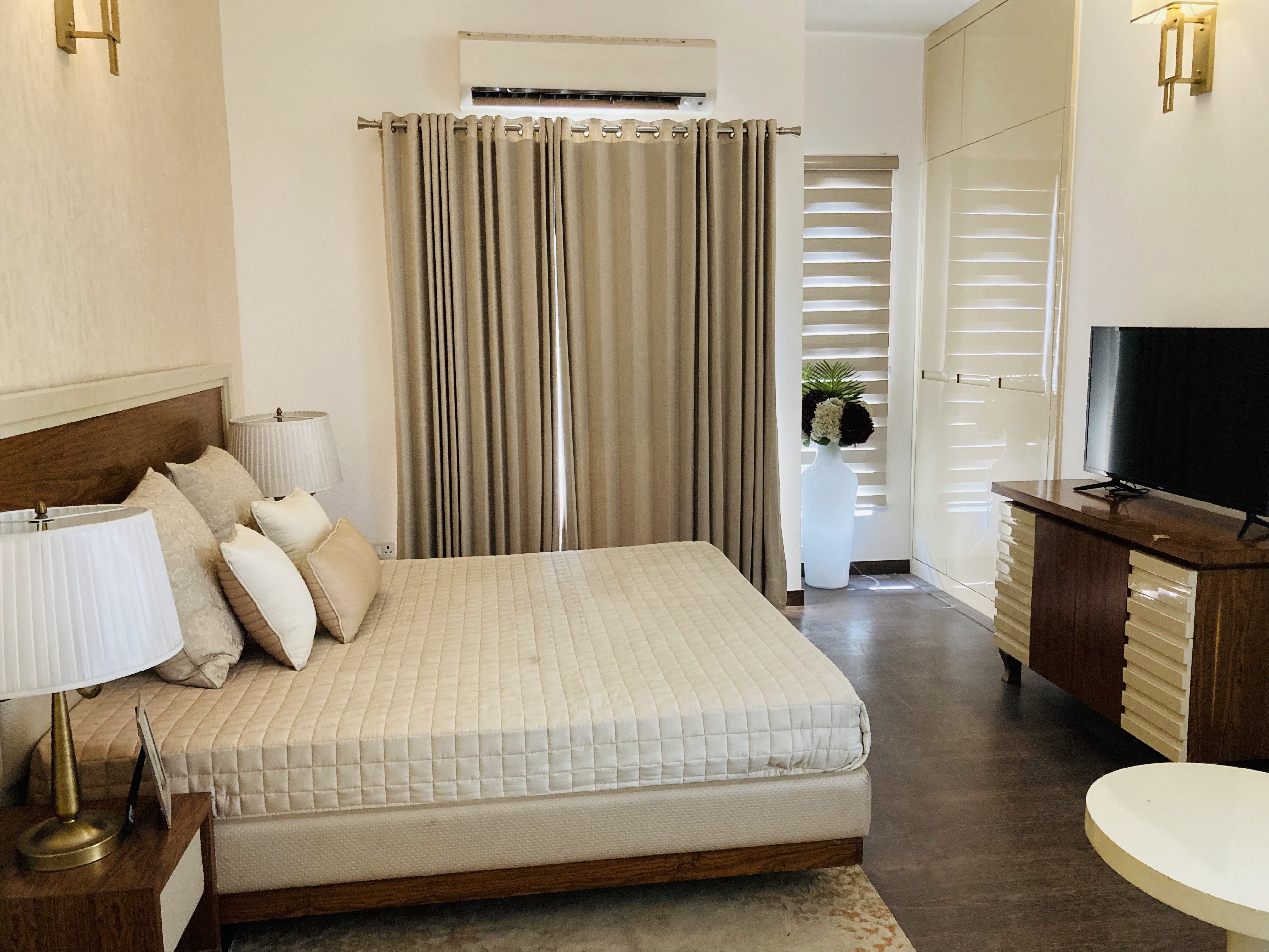 Elite Golf Green — Contemporary bedroom with clean lines and warm palette